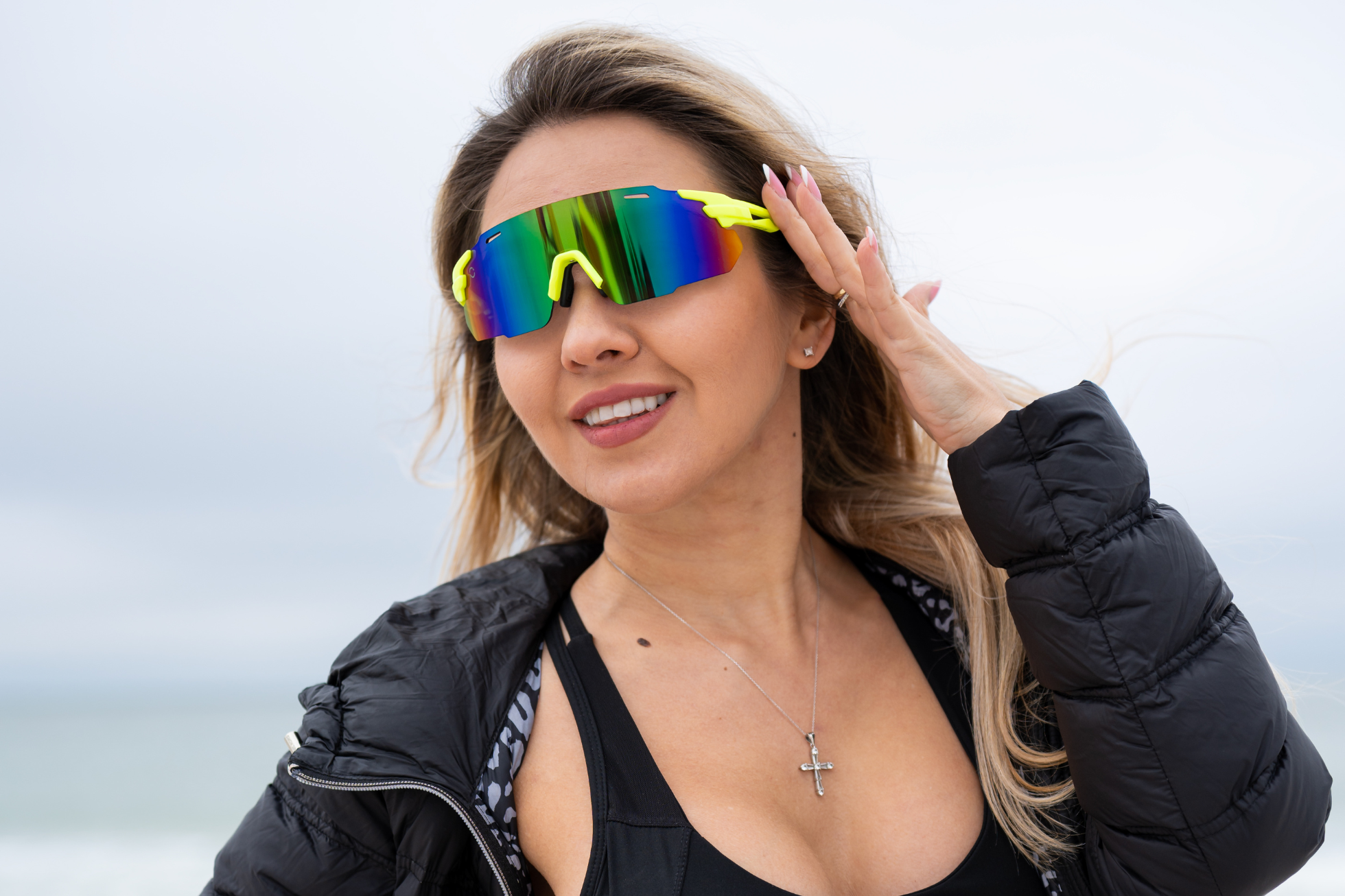 Woman in black jacket wearing sunglasses