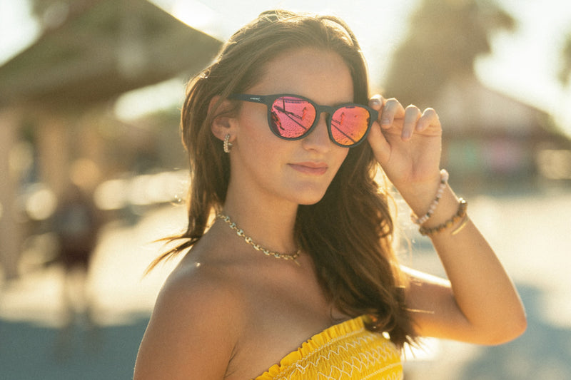 Attractive woman showcasing Kitty Katts sunglasses - Sexy eyewear for a stylish and confident look.